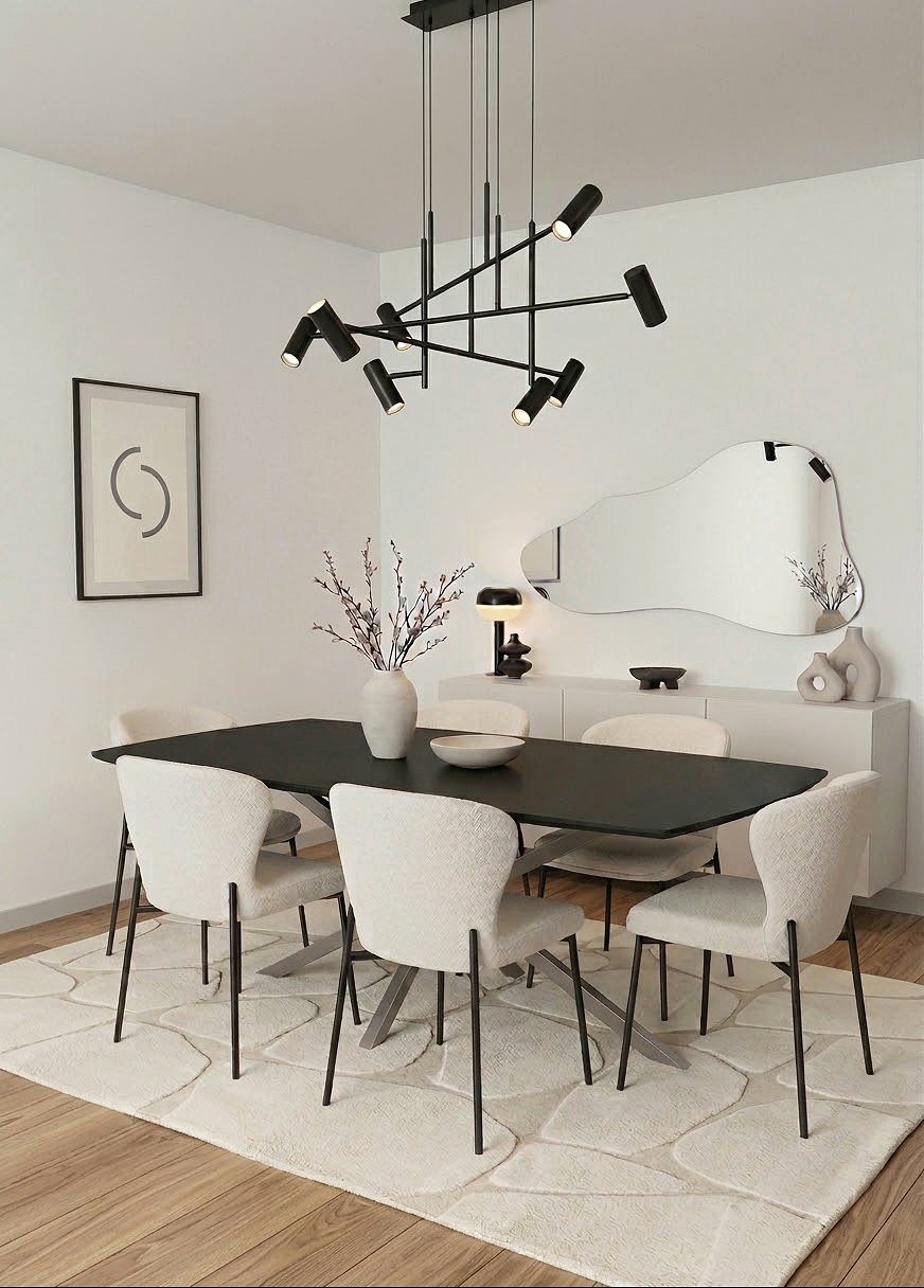 Dining area seating six beneath a spline chandelier